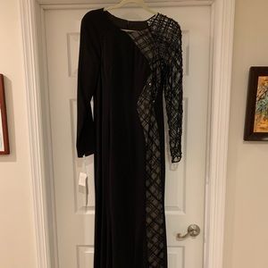 Black long sleeve floor length dress with asymmetric beading down one side